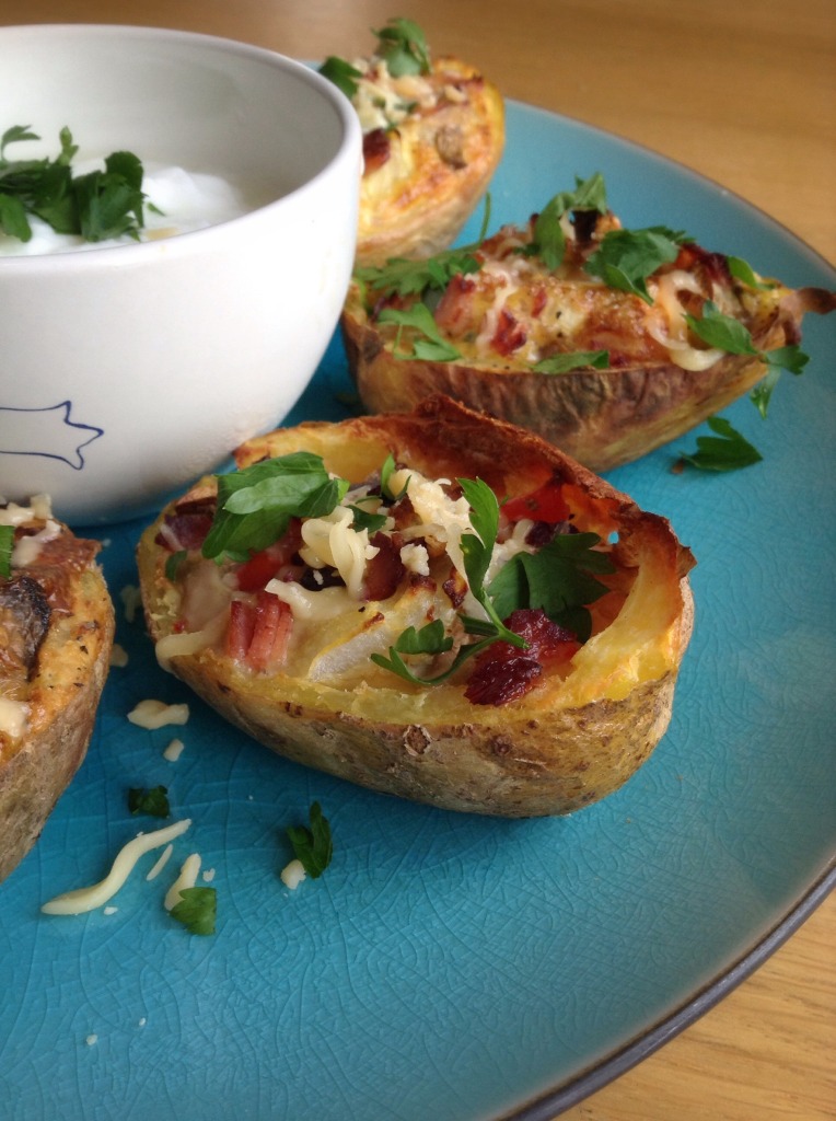 Healthy breakfast potato skins, loaded with bacon, eggs, cheese, onions and mushrooms